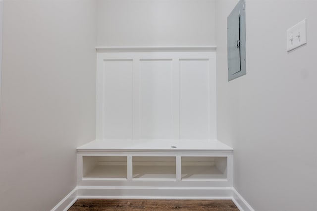 mudroom with electric panel and dark hardwood / wood-style flooring