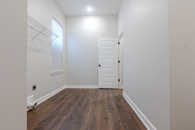 laundry area featuring hookup for an electric dryer and dark hardwood / wood-style floors