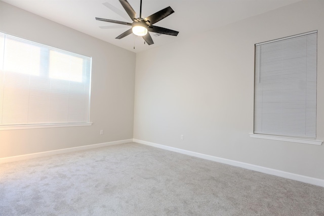 unfurnished room featuring carpet flooring and ceiling fan