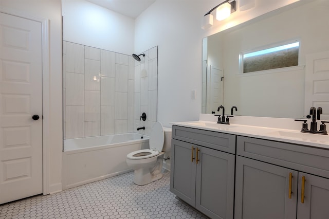 full bathroom with tile patterned floors, toilet,  shower combination, and vanity