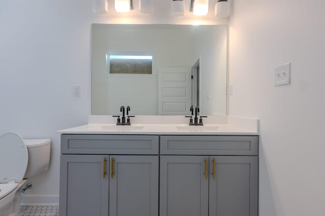 bathroom with vanity and toilet