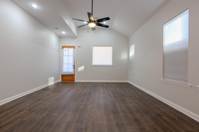 empty room featuring dark hardwood / wood-style flooring, ceiling fan, and lofted ceiling