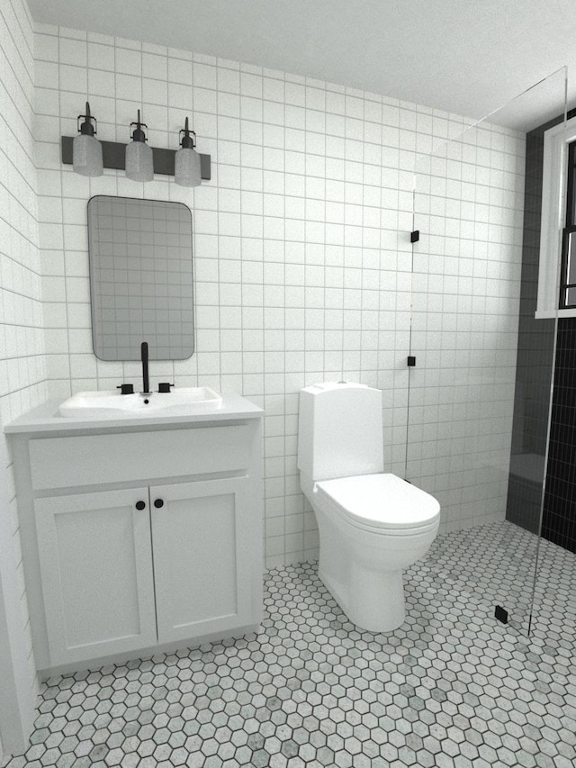 bathroom featuring vanity, tile walls, tile patterned floors, and toilet