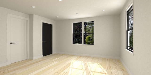 unfurnished bedroom with light wood-type flooring