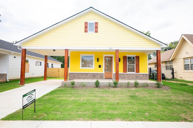 view of front of home with a front lawn and a porch