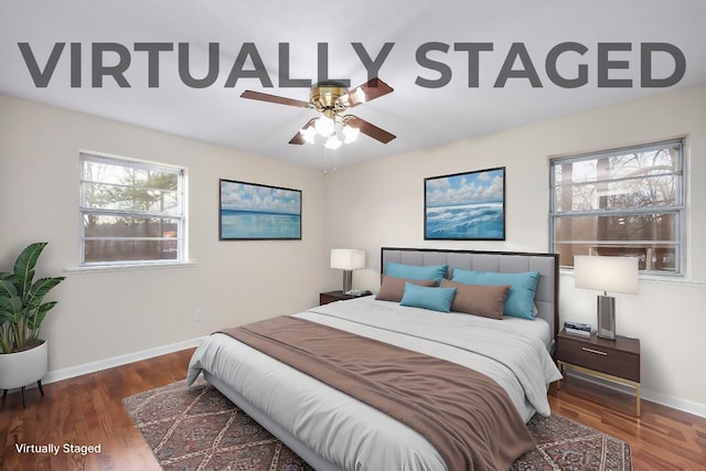 bedroom with dark hardwood / wood-style floors and ceiling fan