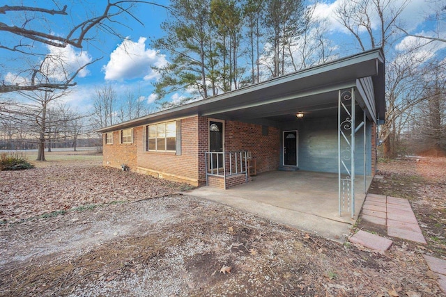 view of front of home with a carport