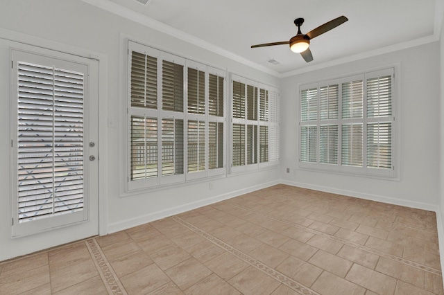 unfurnished sunroom with ceiling fan