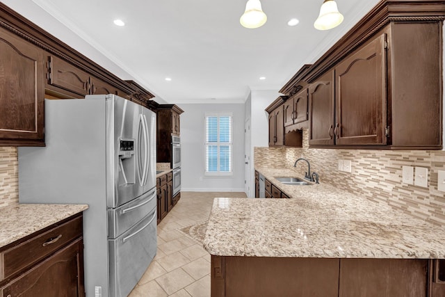 kitchen with stainless steel appliances, ornamental molding, decorative light fixtures, and backsplash