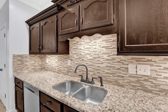 kitchen featuring sink, dark brown cabinets, ornamental molding, decorative backsplash, and stainless steel dishwasher