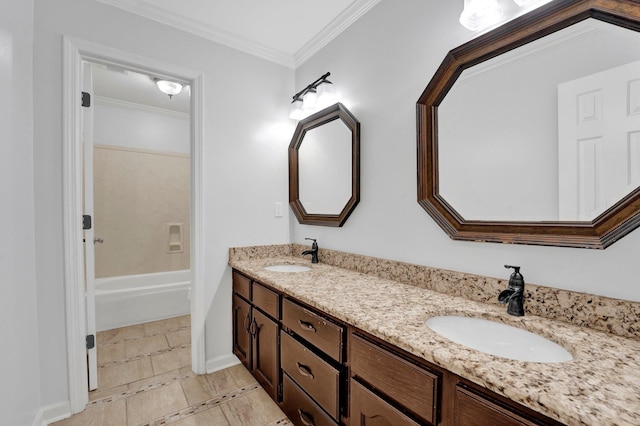 bathroom featuring crown molding, tile patterned floors, and vanity