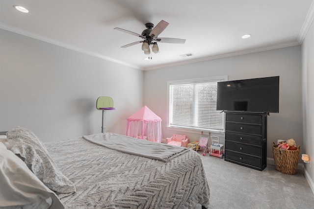 carpeted bedroom featuring crown molding and ceiling fan