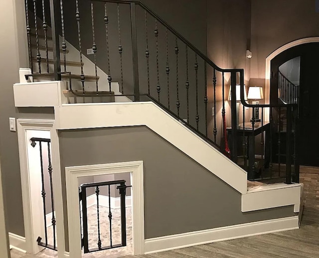 staircase featuring hardwood / wood-style flooring