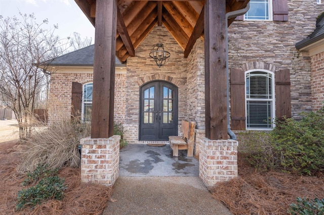 view of exterior entry featuring french doors