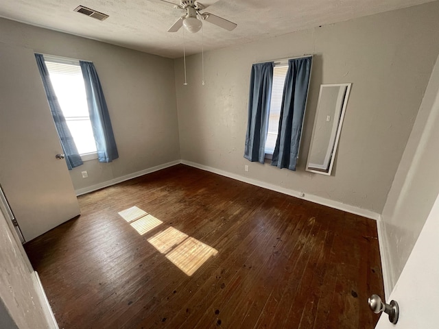 unfurnished room with wood-type flooring, a textured ceiling, and ceiling fan