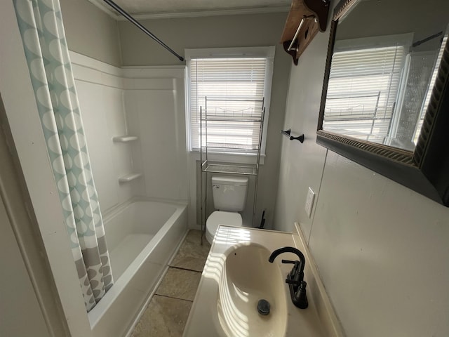 full bathroom featuring toilet, shower / tub combo with curtain, sink, and tile patterned flooring