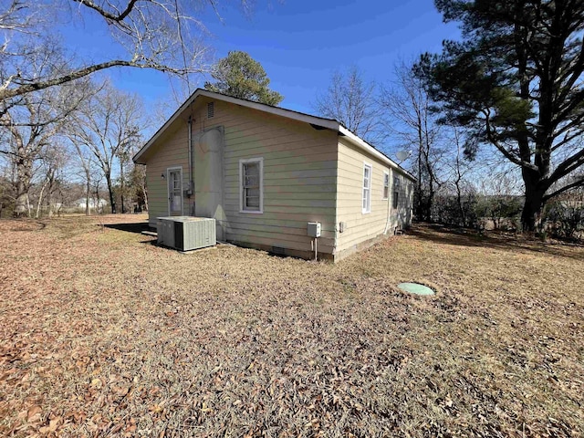 view of side of property with central AC unit