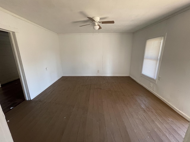 unfurnished room with crown molding, ceiling fan, and dark hardwood / wood-style flooring