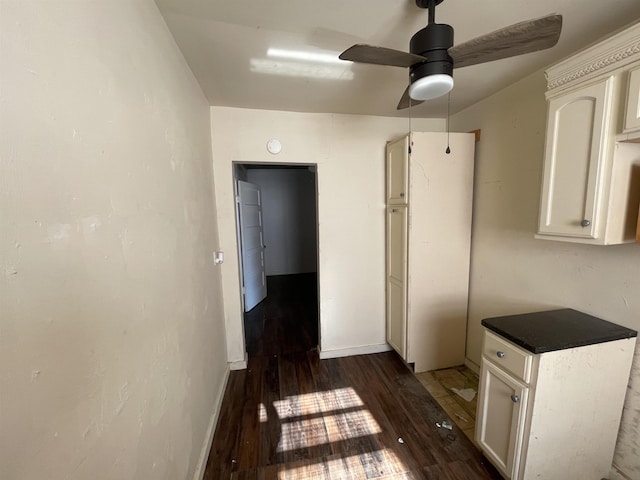 kitchen featuring white cabinetry, dark wood-type flooring, and ceiling fan