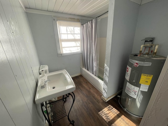 bathroom featuring shower / bathtub combination with curtain, sink, wood-type flooring, and electric water heater