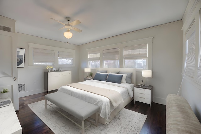 bedroom featuring ceiling fan and dark hardwood / wood-style floors