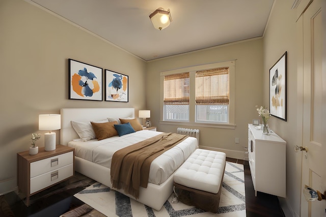 bedroom featuring dark hardwood / wood-style flooring, radiator heating unit, and ornamental molding