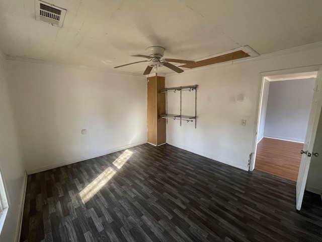 unfurnished bedroom featuring ceiling fan, ornamental molding, and dark hardwood / wood-style floors