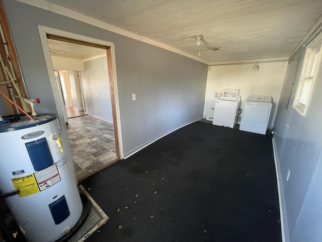 interior space with ornamental molding, washer / dryer, and electric water heater