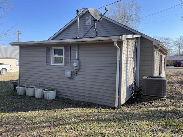 view of side of home featuring central air condition unit