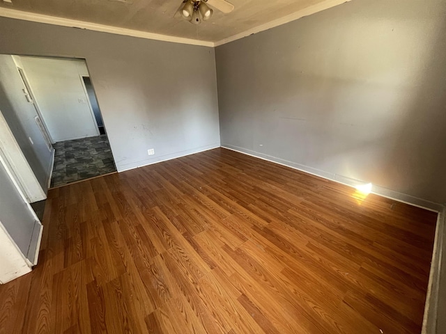 spare room featuring ceiling fan, ornamental molding, and hardwood / wood-style floors