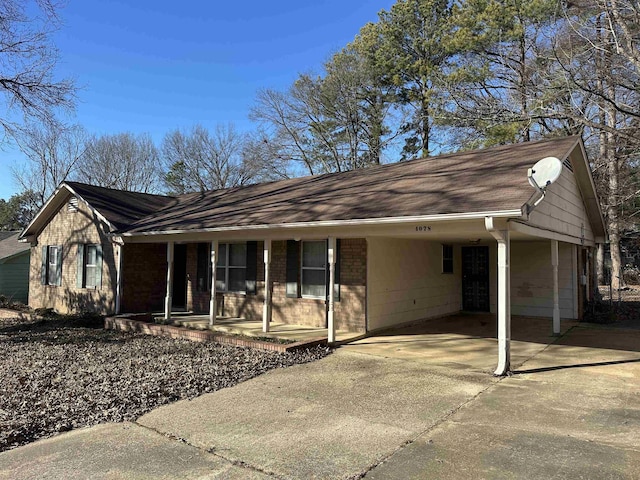 single story home with a carport and a porch