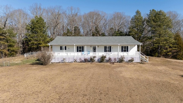 view of front of property with a front yard and covered porch