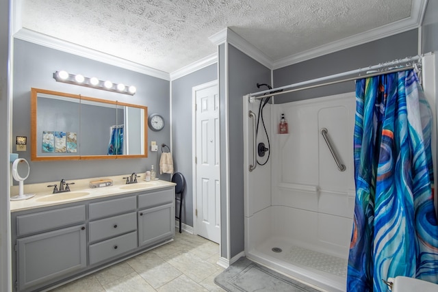 bathroom with vanity, ornamental molding, a textured ceiling, and a shower with shower curtain