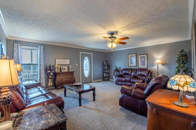 carpeted living room featuring crown molding, ceiling fan, and a textured ceiling