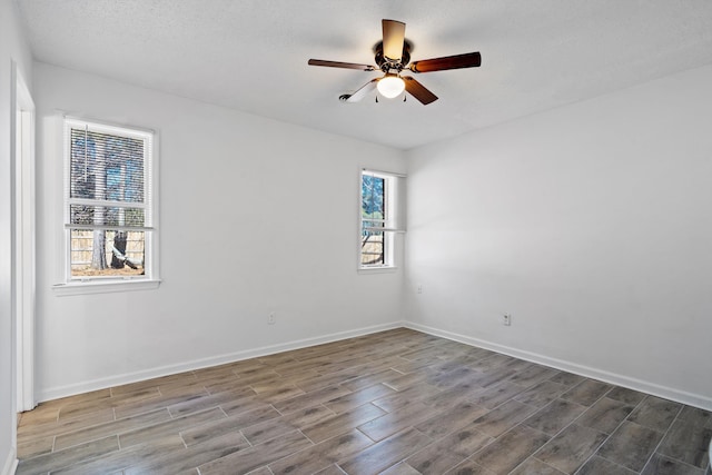 spare room with ceiling fan