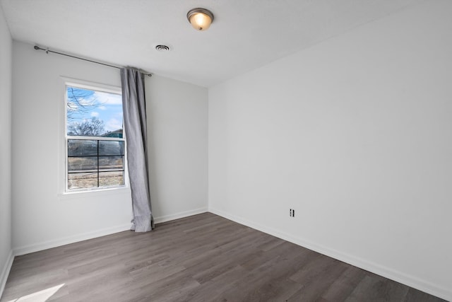 empty room featuring hardwood / wood-style flooring