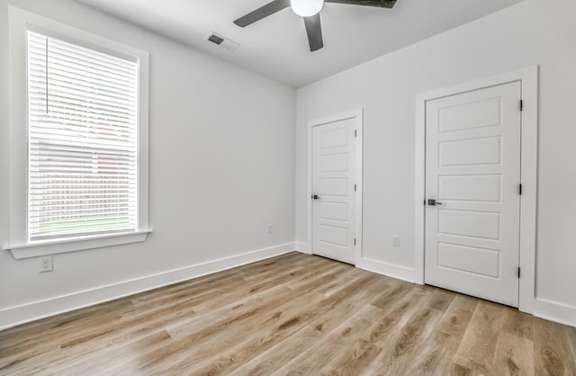 unfurnished bedroom featuring light hardwood / wood-style floors and ceiling fan