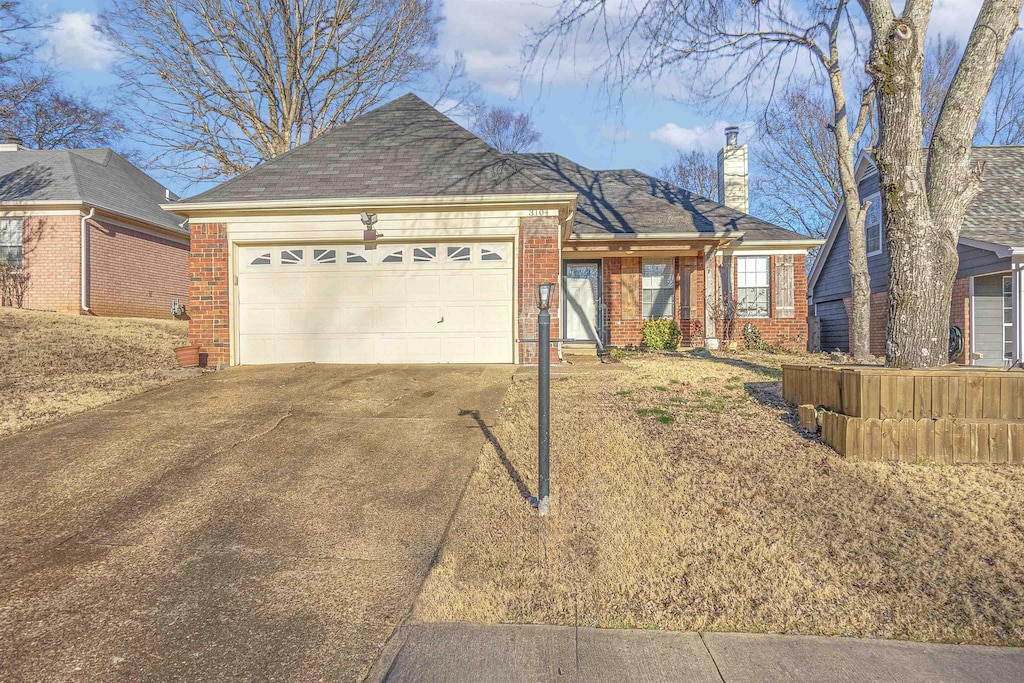 ranch-style home featuring a garage