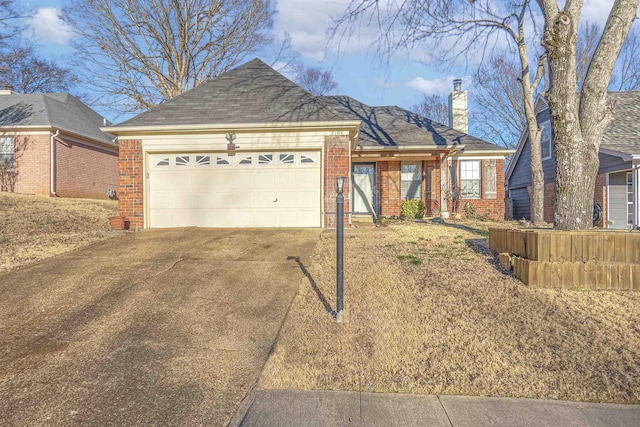 ranch-style home featuring a garage