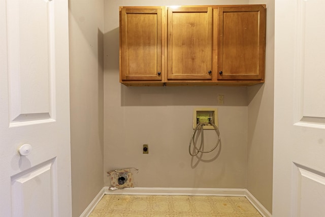 washroom with cabinets, hookup for a washing machine, and electric dryer hookup