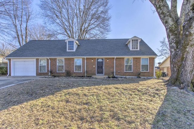 new england style home featuring a garage and a front lawn