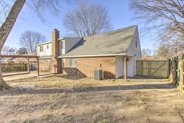 back of property featuring central AC and a patio