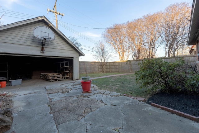 view of patio / terrace featuring an outbuilding and a garage