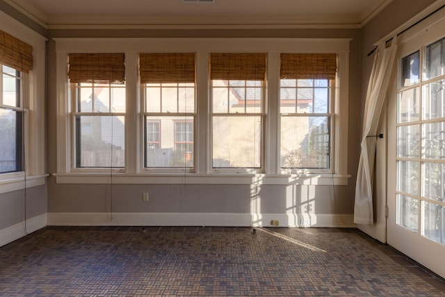 unfurnished sunroom with a healthy amount of sunlight