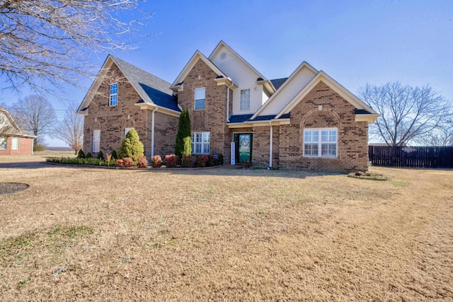 craftsman inspired home with a front lawn