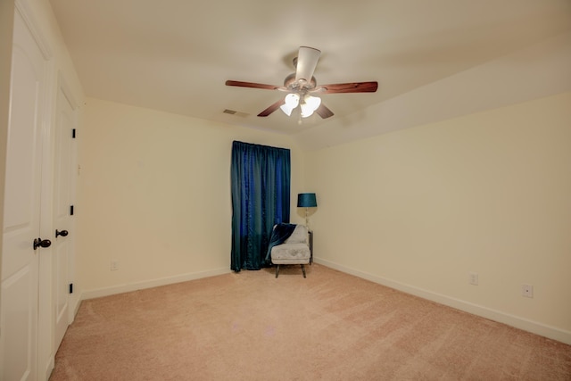 carpeted empty room with ceiling fan