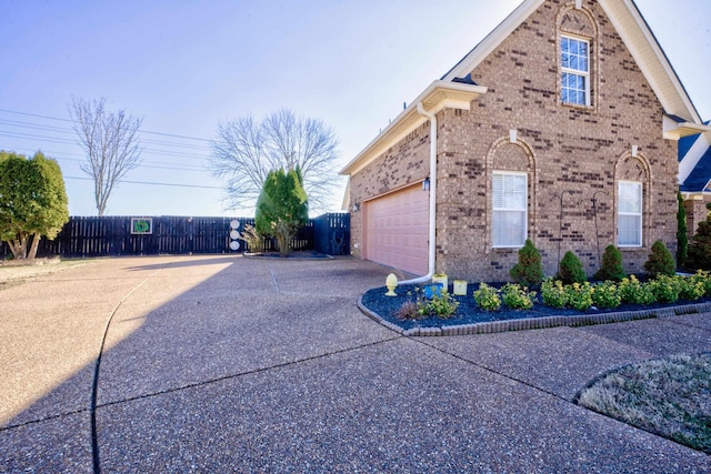 view of property exterior featuring a garage