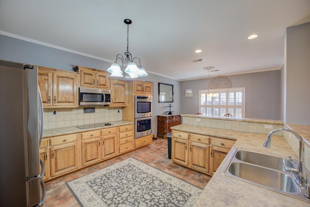 kitchen with pendant lighting, sink, crown molding, stainless steel appliances, and decorative backsplash