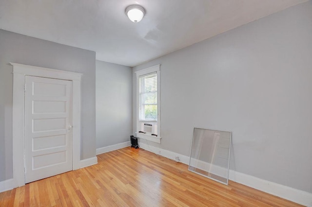 unfurnished room with light hardwood / wood-style floors