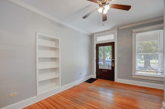 foyer featuring ornamental molding, ceiling fan, and light hardwood / wood-style floors